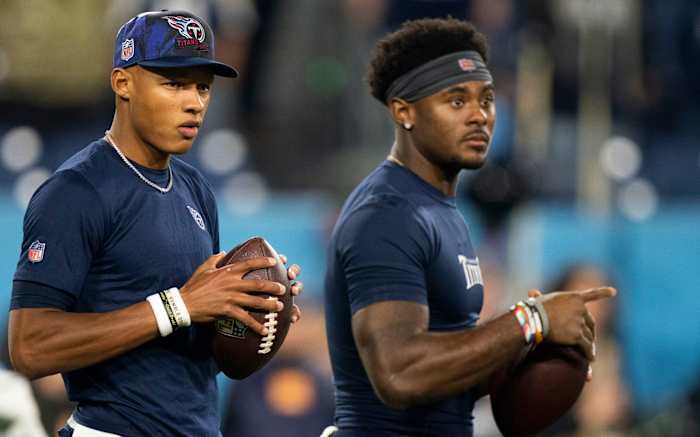 Tennessee Titans quarterbacks Joshua Dobbs (11) and Malik Willis (7) warm up before the game against the Dallas Cowboys at Nissan Stadium Thursday, Dec. 29, 2022, in Nashville, Tenn.